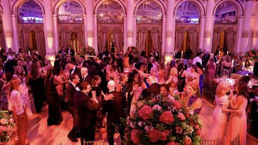 Formally dressed guests dance and mingle at The Society of MSK Spring Ball. 